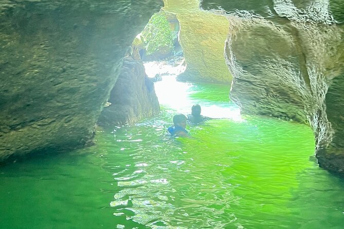 Cave Adventure: Canyon and Hidden Waterfall in Charco Azul - Swimming through three caves