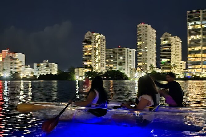 Clear LED Kayaking in Condado Lagoon - Clear kayaks and city lights on Condado Lagoon