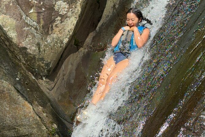 Famous Natural Waterslide in El Yunque Rainforest - A short rainforest walk with a muddy edge