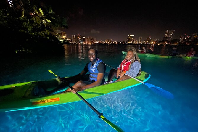 Night Kayak - Condado City Lights Tour - Boarding a clear-bottom tandem kayak