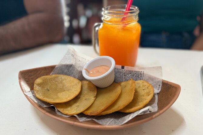 Old San Juan Food Tour with 7 Tastings of Authentic Local Flavors - Calle San Sebastián brings the street life