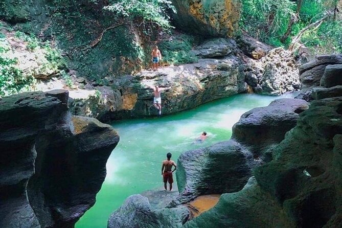 Rainforest Caves and Waterfalls Exploration with Transportation - Weather, water levels, and the cancellation concern