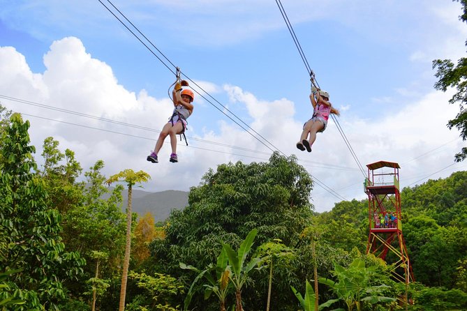 Zipline Canopy Tour with Transport from San Juan - Getting fitted with the safety gear